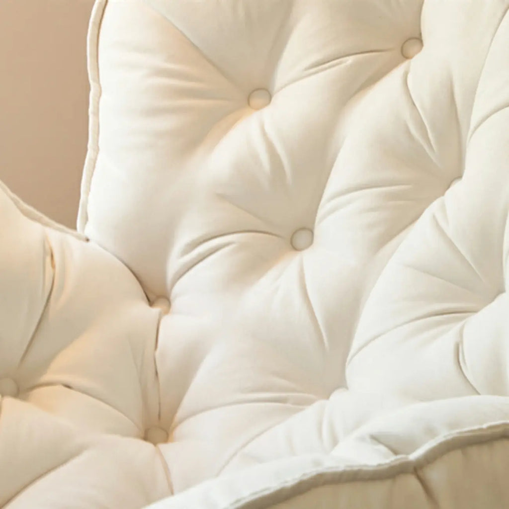 Fauteuil à bascule rembourré couleur crème avec repose-pieds pour salon