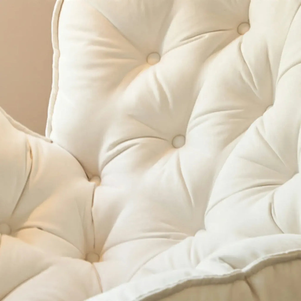 Fauteuil à bascule rembourré couleur crème avec repose-pieds pour salon
