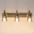 Élégantes lampes de coiffeuse géométriques en laiton au-dessus du miroir