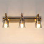 Élégantes lampes de coiffeuse géométriques en laiton au-dessus du miroir
