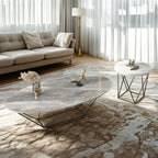 Table basse ovale élégante en métal noir avec piètement géométrique