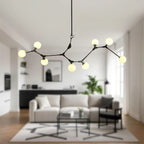 Lustre moderne à 8 lumières avec globe et branches noires, style îlot.