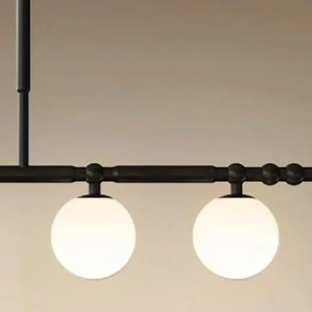 Suspension moderne en métal noir avec globe pour îlot de cuisine