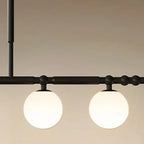 Suspension moderne en métal noir avec globe pour îlot de cuisine