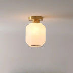Plafonnier semi-encastré moderne en verre blanc et doré, style tambour.