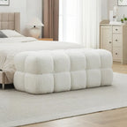 Banc de chambre moderne en forme de nuage, recouvert de tissu bouclé.