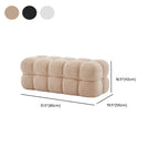 Banc de chambre moderne en forme de nuage, recouvert de tissu bouclé.
