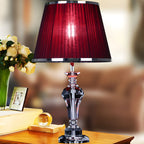 Lampe de table contemporaine en tissu rouge et pied en cristal