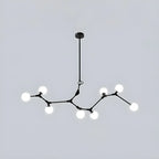 Lustre moderne à 8 lumières avec globe et branches noires, style îlot.