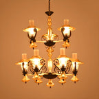 Lustre suspendu vintage en forme de lanterne dorée à 9 lumières, en verre côtelé transparent, avec un design à 2 niveaux.