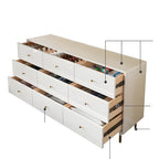 Commode moderne en bois blanc avec poignées dorées